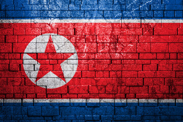 National flag of North Korea on brick  wall background.The concept of national pride and symbol of...