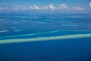 Aerial view of Maldives atolls is the world top beauty. Maldives tourism. Luxury travel destination, amazing nature environment, islands atoll and coral reef. Tropical landscape, aerial view