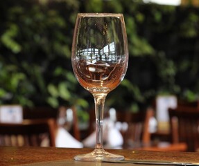 Wine glass, made of glass, empty, bright in light and delicate to look at