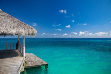 Over water luxurious spa in the tropical blue lagoon of Maldives. Amazing shades of blue, ocean...