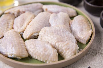 Raw chicken wings, meat with ingredients for cooking