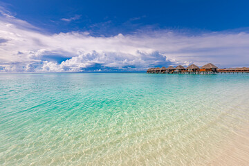 Perfect white sand beach and turquoise tropical ocean in Maldives. Luxury summer holiday and vacation vibes concept. Relax beach, tranquility and peaceful nature. Shore or coast in exotic island