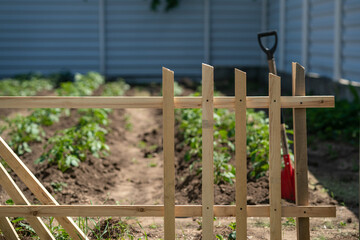 Building a wooden fence. Part of wooden fence.