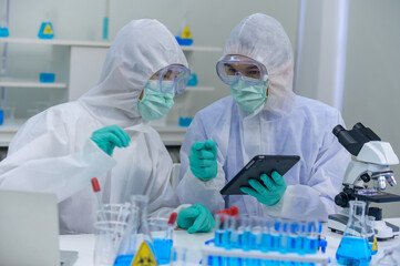 Scientist team has researching Coronavirus cure in the laboratory. Asian Doctor working on vaccine...