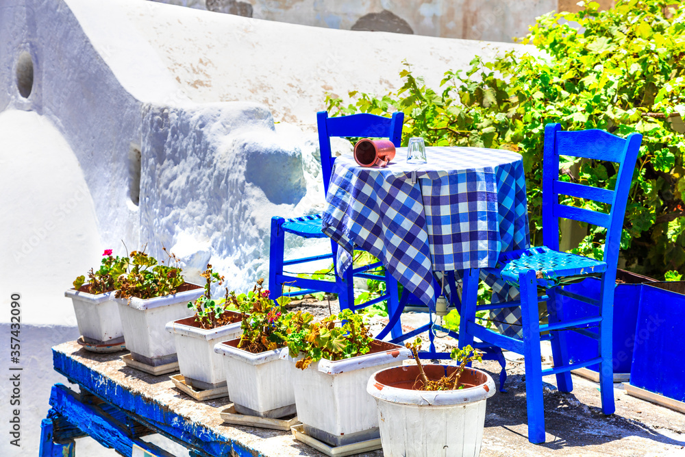 Wall mural Traditional Greece. Typical street restaurants (taverns) of Greece. Naxos, Cycades.