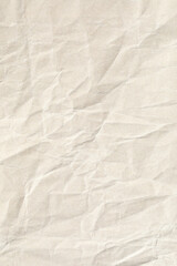 Old pale brown crumpled background paper texture