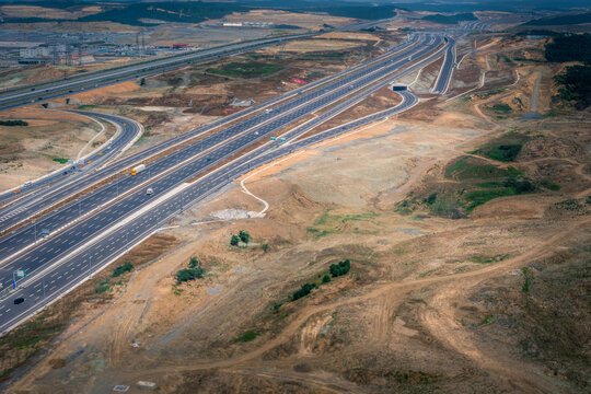 Landing at Turkey airport in Istanbul. Aerial view from airplane of landscape and highway. Amazing infrastructure and poor soil. Wide shot at daylight
