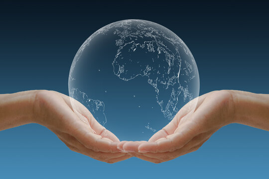 Hand cradle the globe Concept for the environment.