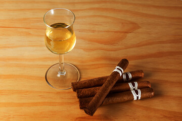 Cuban cigars with a glass of rum