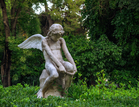 Statue of a young angel, Eros, at the Zappeio Gardens in Athens