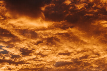 Fototapeta na wymiar Orange clouds in the sky during sunset