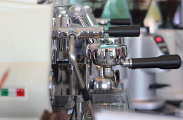 Close up of coffee holder. Professional coffee machine. Bistro or restaurant.