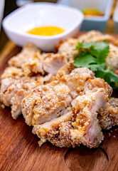 Taiwanese style dep friend chicken chop served on a wooden board