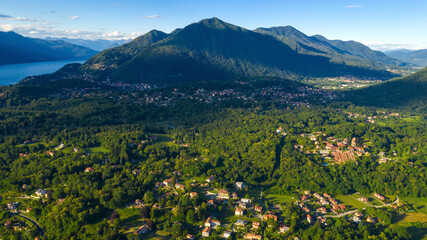 Naklejka na ściany i meble Aerial view of the mountains on the border between Italy and Switzerland during the summer season