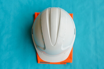 construction safety helmet on blue background