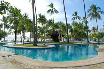 Swimming pool and coconut trees at Dos Palmas island resort in Honda Bay, Puerto Princesa, Palawan,...