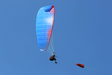 Paraglider being towed on a winch launch