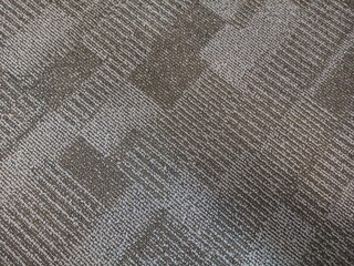 Grey office carpet pattern interior. Ash color fabric background