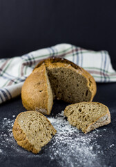Bread on black background. Slices bread.