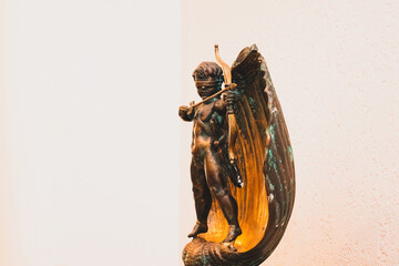 metal cupid on a stand