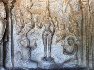 Bas relief rock cut sculptures of gods, people and animals are carved prominently in the monolithic cave temples at Mahabalipuram, Tamil nadu, India