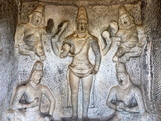 Bas relief rock cut sculptures of gods, people and animals are carved prominently in the monolithic cave temples at Mahabalipuram, Tamil nadu, India