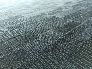 Blue color fabric background. Dark blue office carpet pattern interior. 