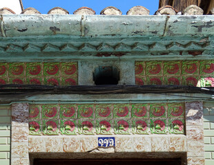 Detail of Revival tiled decoration in a house. Cabanyal Quarter in the City of Valencia. Spain.   