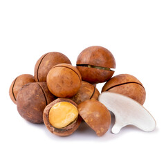 Group of shelled and unshelled macadamia nuts with key isolated on white. Seeds of the australian nuts also known as macadamia. Macro food photo close up view.