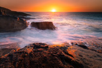 Sunset in the basque coast under Jaizkibel mountain in Hondarribia, Basque Country.	