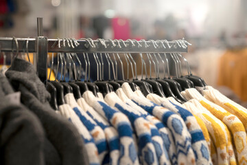 Fototapeta premium trendy cloth dress hanger in fashion boutique store in department mall