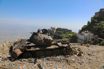 A tank belonging to Al-Houthi militia after being damaged by the Popular Resistance in Jabal Sabr ...