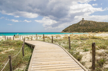 Walking to a beach in the southeast of Sardinia (Italy).