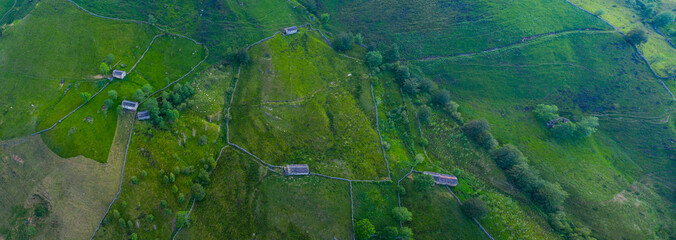 Spring landscape of mountains, meadows of mowing and cabins pasiegas near La Concha, in the Valle del Miera, Cantabria, Spain, Europe