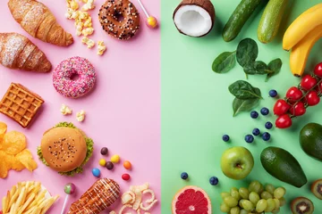Foto op Plexiglas Healthy and unhealthy food background from fruits and vegetables vs fast food, sweets and pastry top view. Diet and detox against calorie and overweight lifestyle concept. © juliasudnitskaya