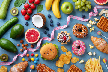 Healthy and unhealthy food background from fruits and vegetables vs fast food, sweets and pastry...