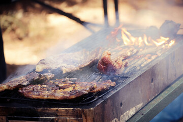 Roasting a steak on a hot BBQ grill