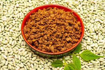 Love vegan and vegetarian food concept, plant based minced meat in plate on soya beans background