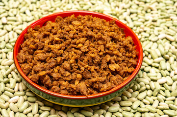 Love vegan and vegetarian food concept, plant based minced meat in plate on soya beans background