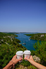 Fototapeta na wymiar Two white cup with coffee over the bay