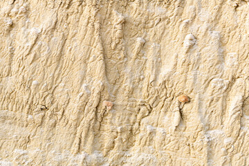 Unique textured rock with stones in it for a background