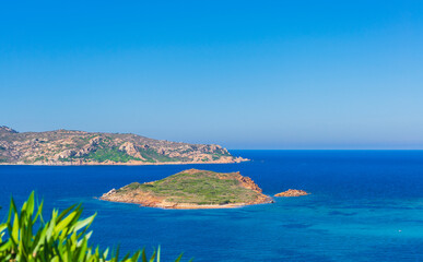 Obraz premium Bay and islet in Capo Coda Cavallo (Olbia, Sardinia, Italy).