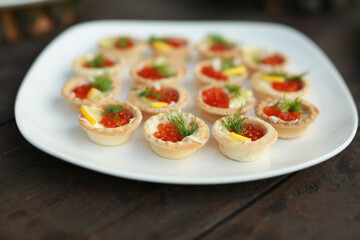 beautiful tasty tartlets with red caviar
