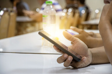 Man pointing on smartphone screen, chatting in social networks, meeting website, searching internet, using text messenger or online banking. Close up of male hands
