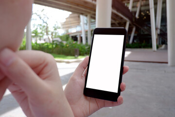 Cropped shot view of business woman’s hands holding the mobile phone with blank copy space screen for your information content or text message.