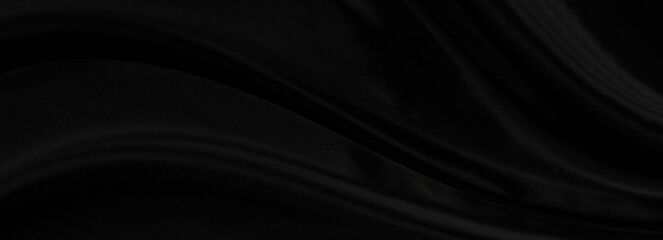 Black gray satin dark fabric texture luxurious shiny that is abstract silk cloth panorama background with patterns soft waves blur beautiful.