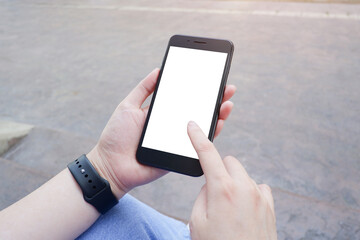 Cropped shot view of business woman’s hands holding the mobile phone with blank copy space screen for your information content or text message.