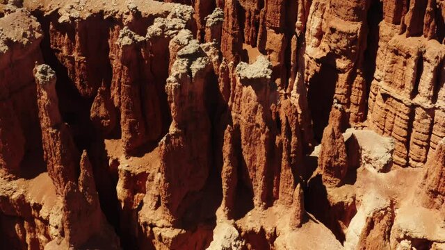 Cinematic aerial of Bryce Canyon National Park, red rocky spires, natural phenomena, landscape of another planet, scenic Utah