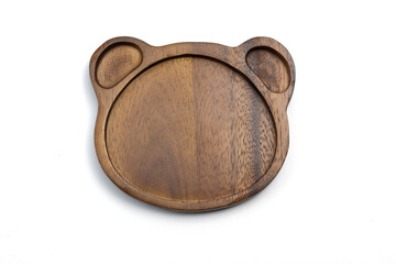A bear shaped wooden plate on a white background