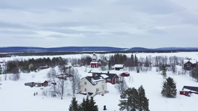 Aerial shot of Jukkasjärvi's church in Kiruna, Swedish Lapland. Winter.